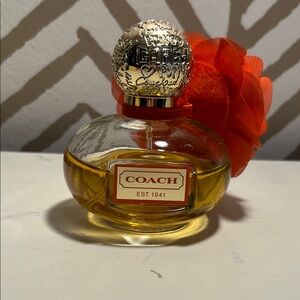 Partially Used Coach Poppy Eau de Parfum with Gold Cap and Orange Floral Accent